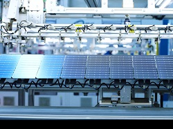 Automated solar cell assembly line in a clean energy manufacturing plant,with photovoltaic cells on a production conveyor