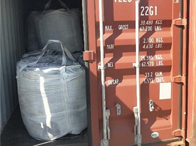 Shipping container loaded with white 1-ton bulk bags of premium inoculant stacked neatly for export to Africa market