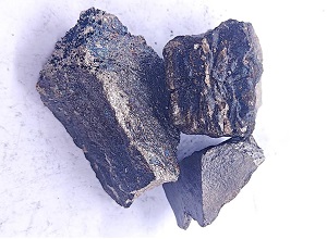 Close up appearance of high carbon ferro manganese 65% lump showing surface texture and shape