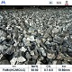 ferro manganese lump products in warehouse with table showing Mn 65-80%,C 0.7-8.0%,size 10-80mm