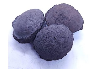 Silicon carbide briquette 65 appearance showing typical oblate spheroidal briquette, dark color, smooth surface texture - Bright Alloys